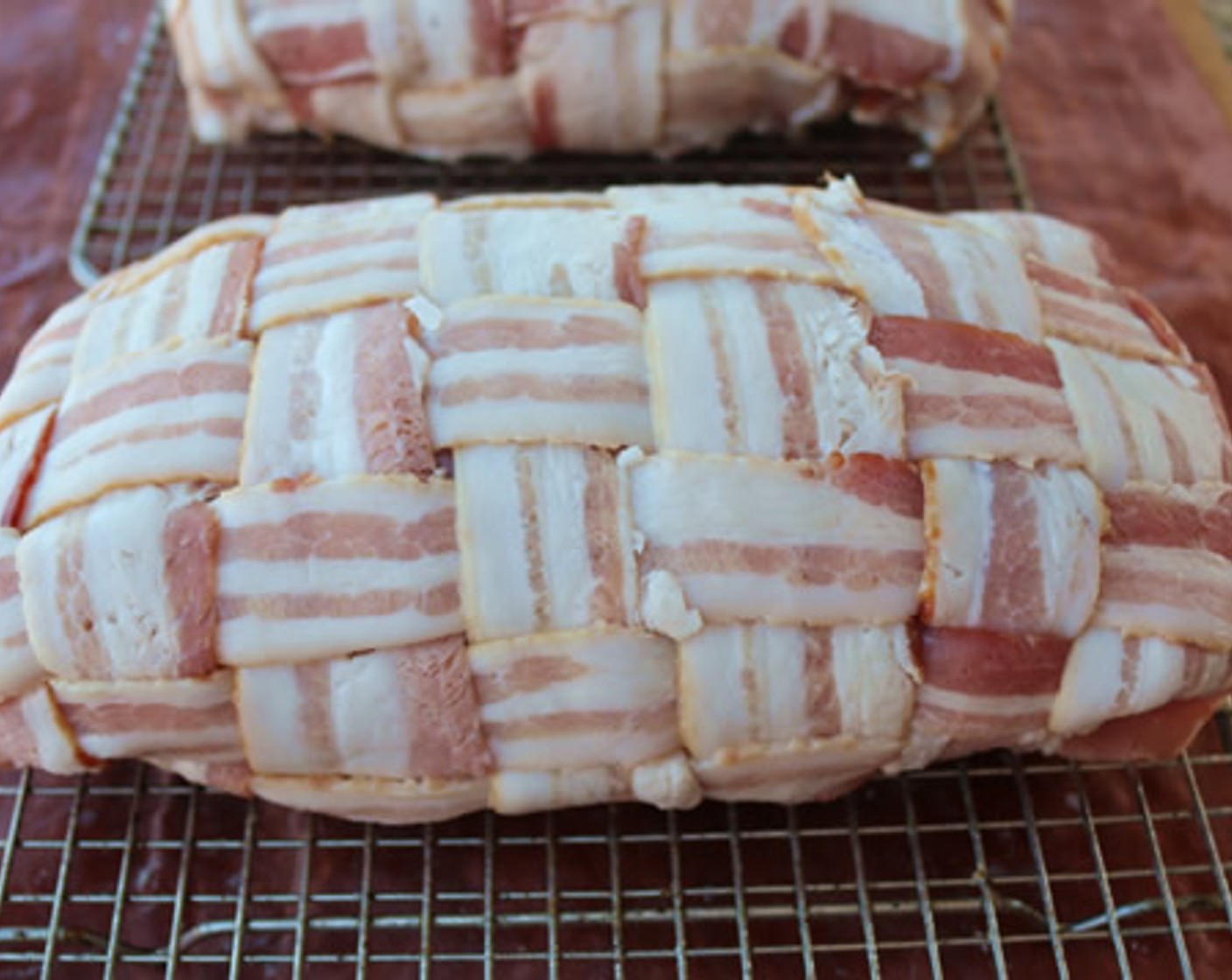 step 8 Unwrap each mini turducken and place on bacon weave turkey side down. Wrap bacon around turducken and fold edges. Place on greased wire cooking rack.