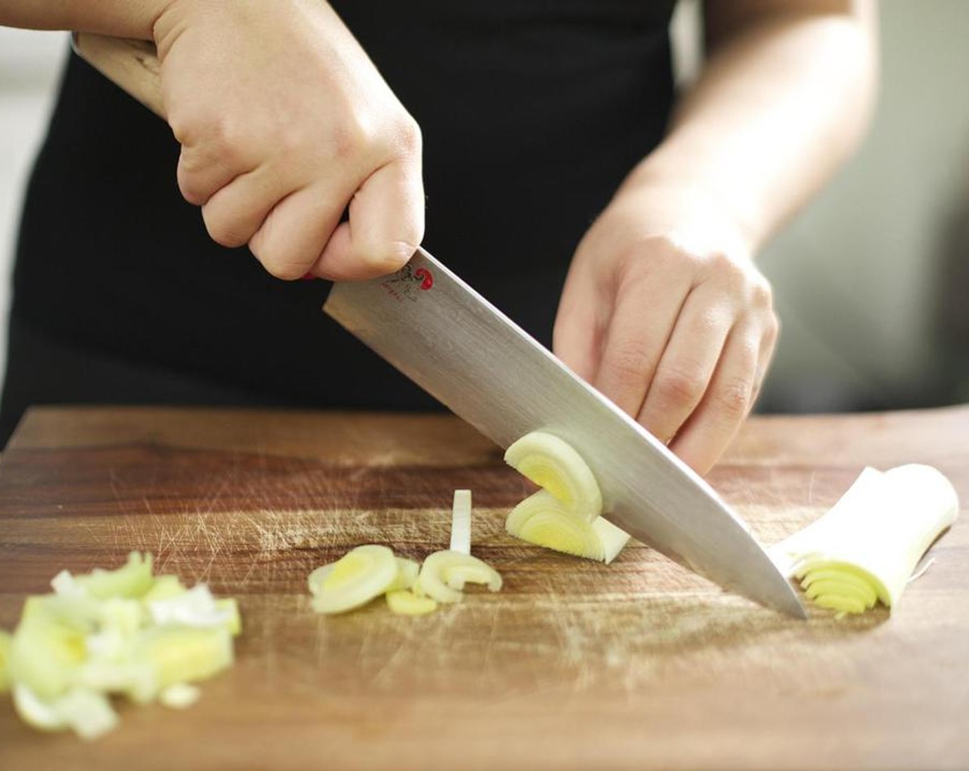 step 1 Peel Sweet Potato (1) and cut into half inch cubes and set aside. Slice the Scallion (1 bunch) thinly on the bias, and set aside. Cut the Leeks (2 cups) in half lengthwise and then into quarter inch slices across and set aside.