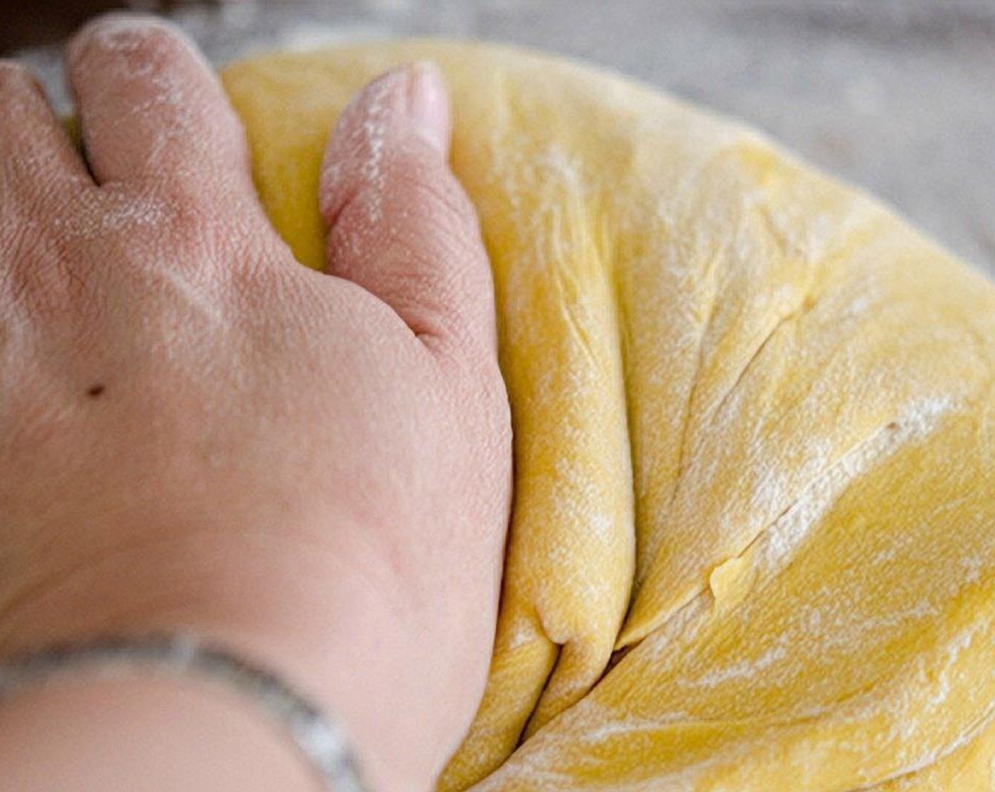 step 6 Dump the dough on the lightly floured surface and knead with your hand for 1 minute.