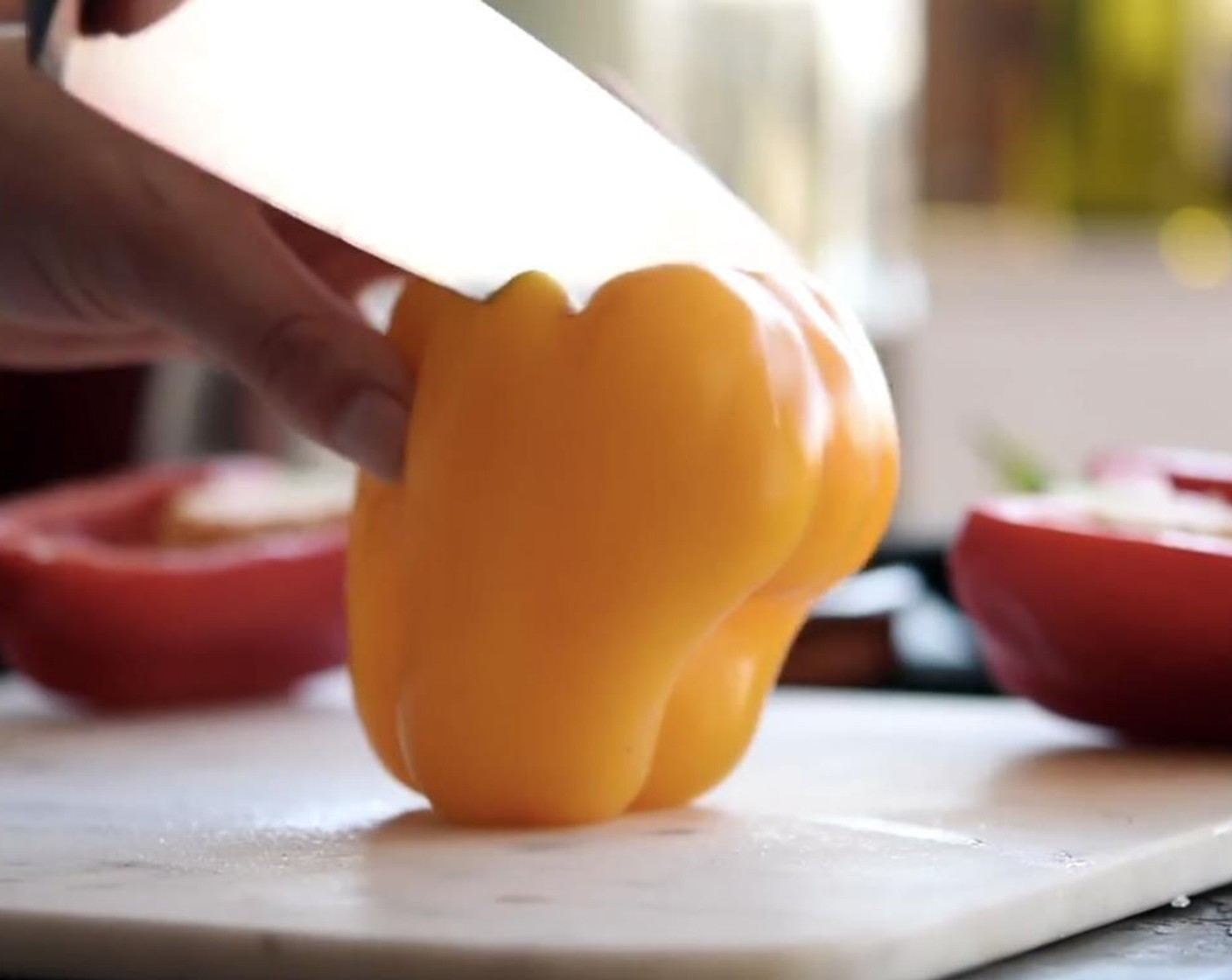 step 2 Cut the Yellow Bell Peppers (3) in half and remove the seeds but leave the stalks intact.