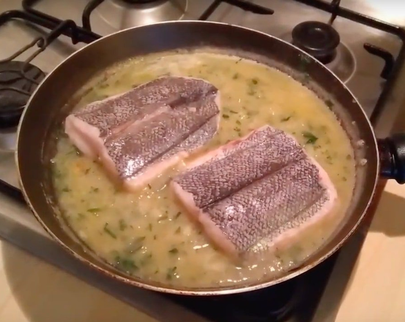 step 9 Add Skinless Hake Fillets (2) and cook them in the show heat for a few minutes.
