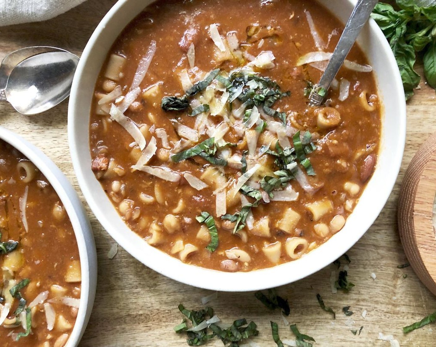 step 6 Stir in the Parmesan Cheese (1/2 cup) and the Red Wine Vinegar (1 Tbsp). Ladle the soup into large shallow bowls and add a swirl of olive oil, a sprinkle of Parmesan and some Fresh Basil Leaves (to taste). Serve hot with extra Parmesan on the side.