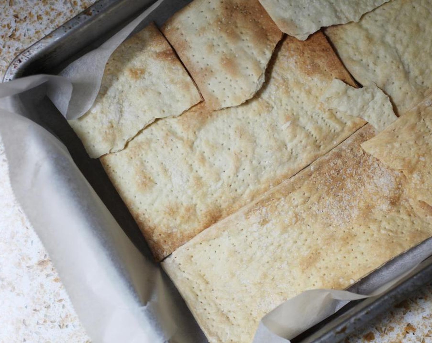 step 2 Line the bottom of a lined baking tray with the Matzo (8 pieces), breaking up pieces if you need to fill in any gaps.