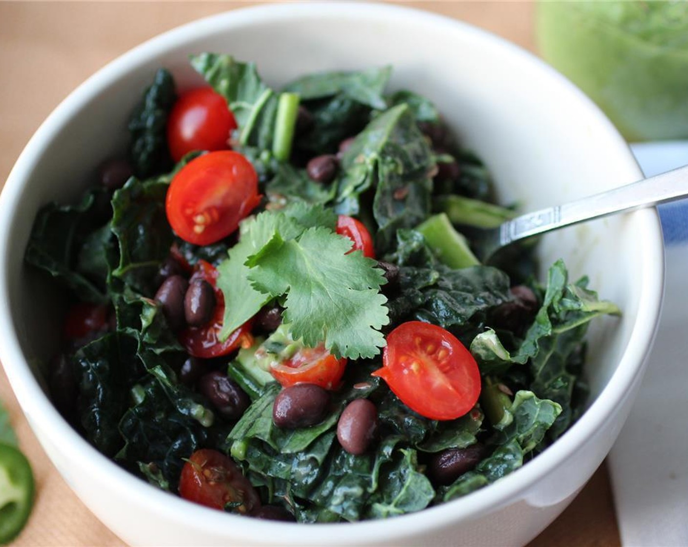 step 4 Drain and rinse the Black Beans (1/4 cup). Destem and chop the Kale (1 1/2 cups). Chop the Tomato (1/2 cup). Add the kale, tomatoes, black beans and Flaxseeds (1/2 Tbsp) to a bowl. Serve with as much dressing as you want and enjoy!