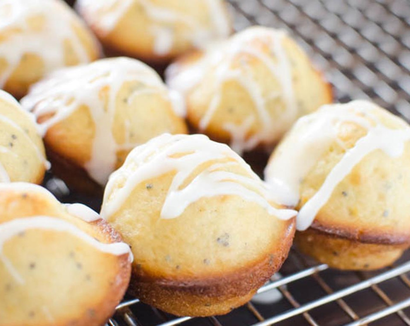 step 6 Meanwhile, stir together the Powdered Confectioners Sugar (2 cups) and Milk (2 Tbsp) until smooth. Make sure the muffins are room temperature, then drizzle them with the glaze. Serve and enjoy!