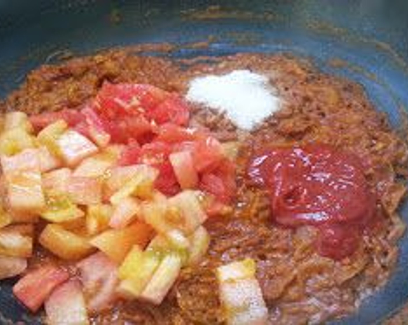 step 9 Add the Tomato (1), Canned Tomato Purée (2 Tbsp), and Salt (to taste).