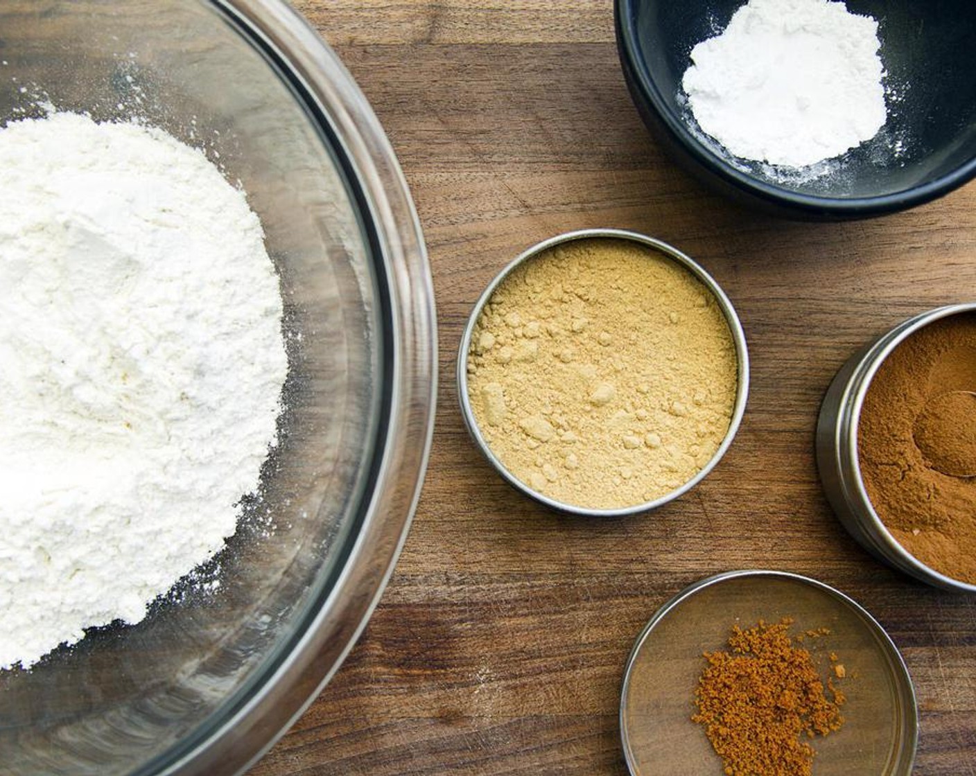 step 4 In a large mixing bowl, combine Whole Wheat Flour (1 3/4 cups), Baking Powder (1/2 tsp), Baking Soda (1/2 tsp), Ground Cinnamon (1 tsp), Salt (1/2 tsp), Ground Ginger (1/2 tsp) and Ground Nutmeg (1/4 tsp). Blend with a whisk.