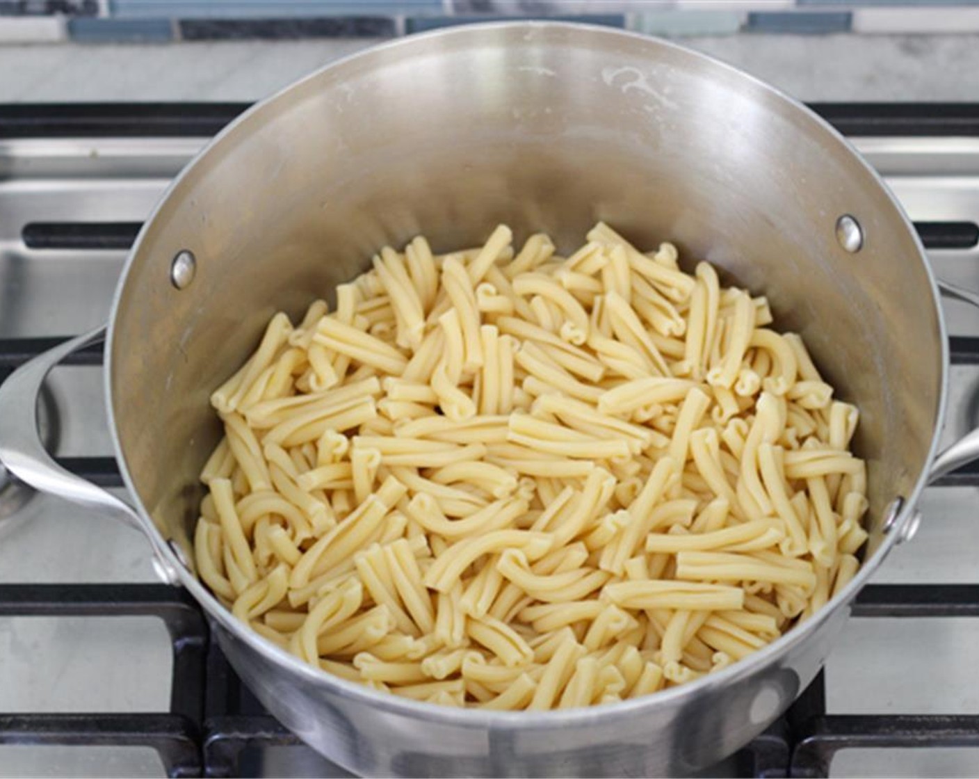 step 2 Place a large pot of salted water on the stove to bring it to a boil for the Pasta (1 lb). Cook the pasta for about 3 minutes less than the package instructions, so that the pasta is slightly undercooked.