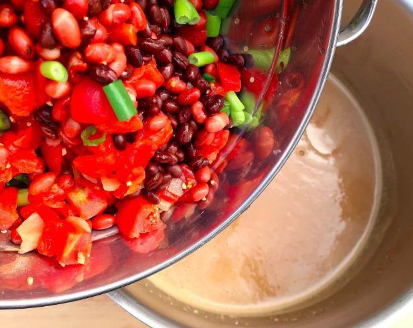step 5 Add Diced Tomatoes (1 can), Black Beans (1 can), Red Kidney Beans (to taste), and Scallions (3 stalks). Simmer for 3 minutes.