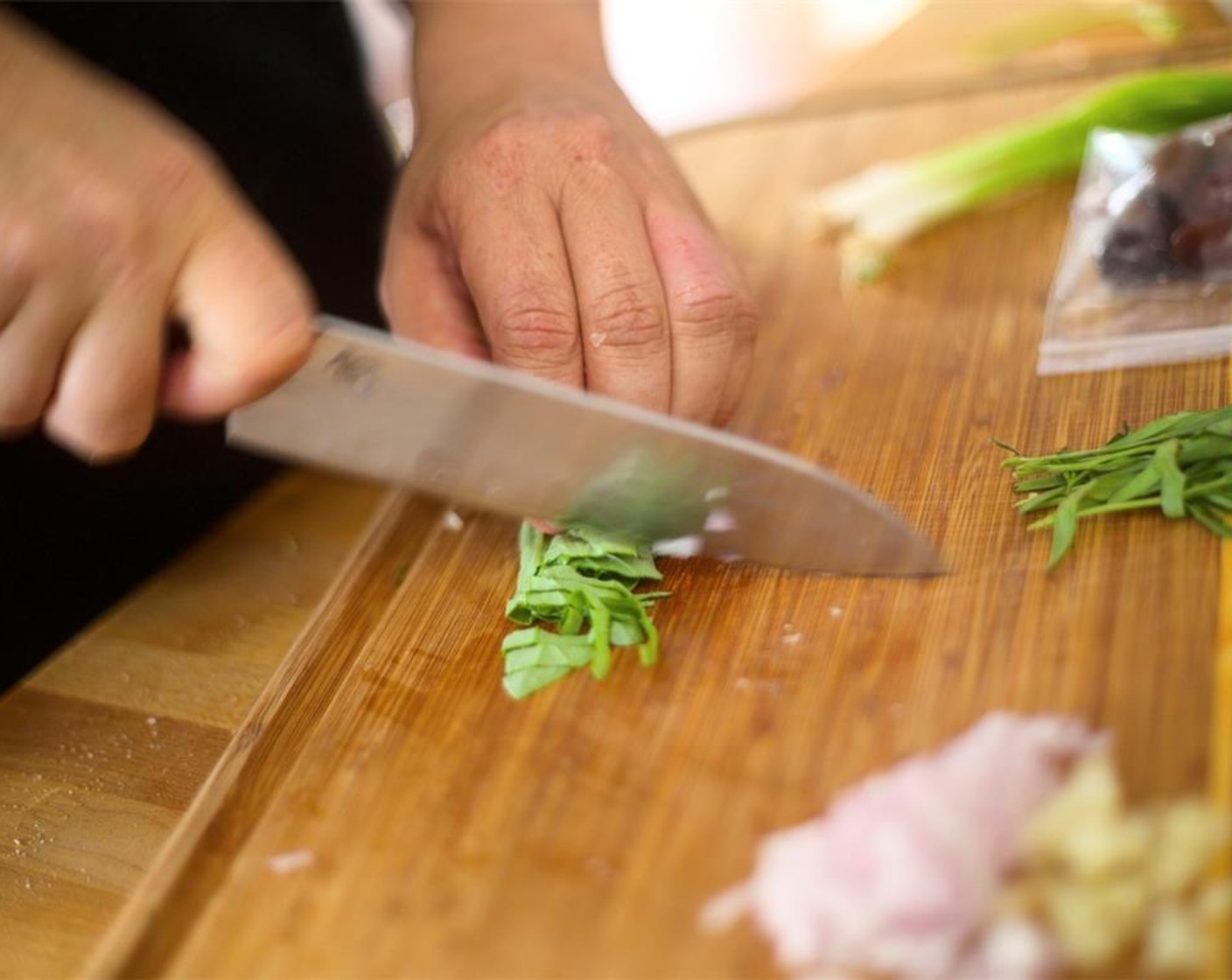 step 6 Remove leaves from Fresh Basil (1 1/2 cups) and Tarragon (1/2 cup), discard stems and roughly chop leaves. Roughly chop the olives and set aside. Thinly slice the Scallion (1 bunch) on a long bias cut and hold for garnish.