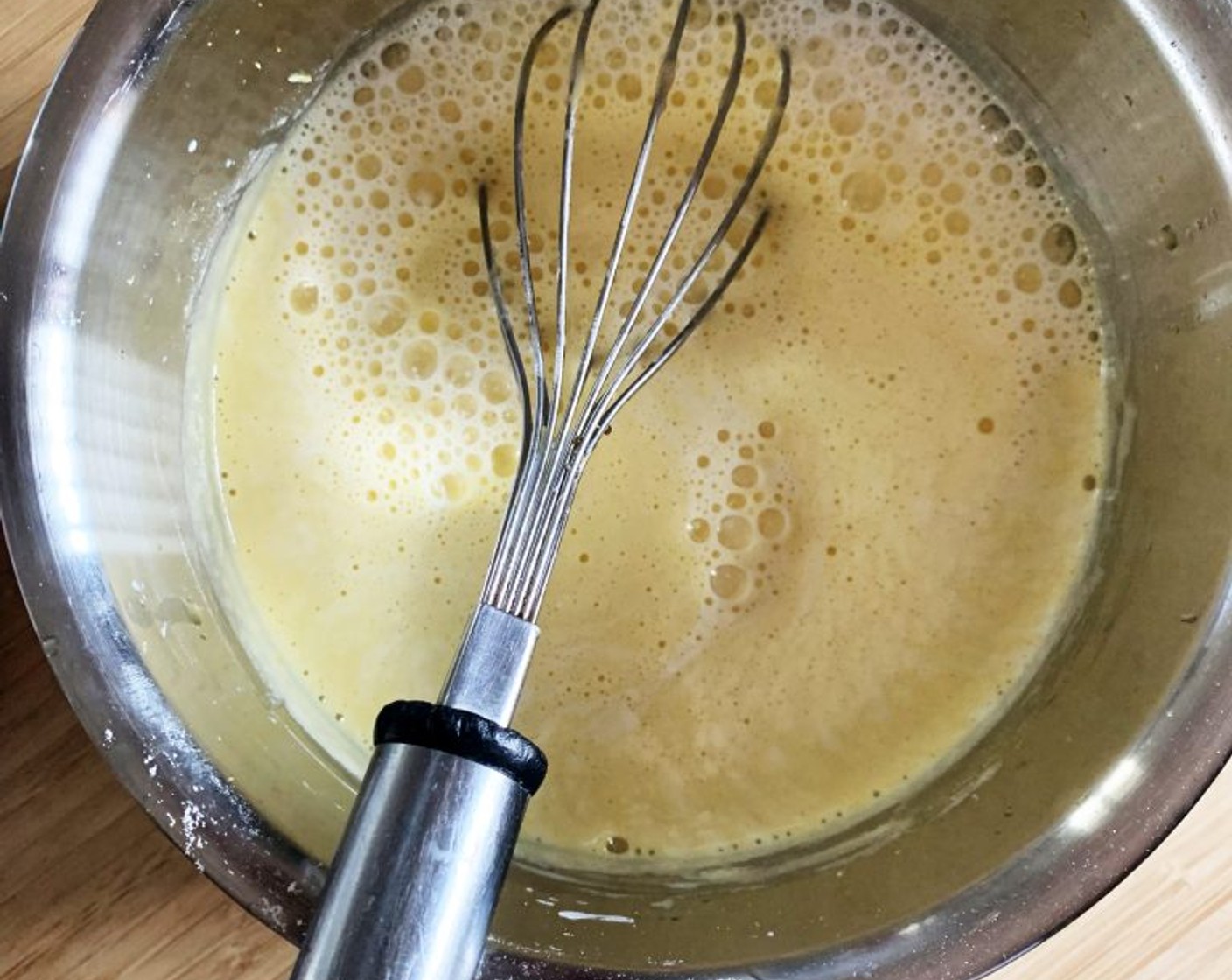 step 3 Next squeeze in the juice of an orange and slowly pour in the Oat Milk (1 2/3 cups), whisking constantly.