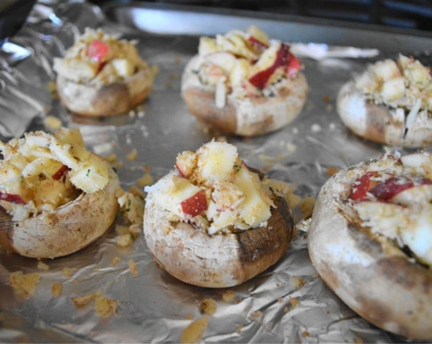 step 5 Take the mushrooms out when they are done roasting and stuff each one to the brim with the filling. Put the trays back into the oven to let the mixture meld and get bubbly while the mushrooms get super tender for 15 minutes.