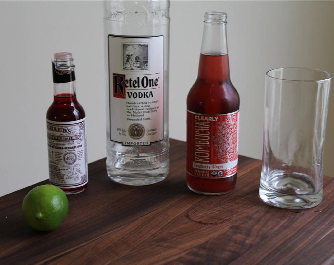 step 1 Cut the Lime (1) into wedges. In a Collins glass, squeeze a lime wedge and add the peel to the glass.