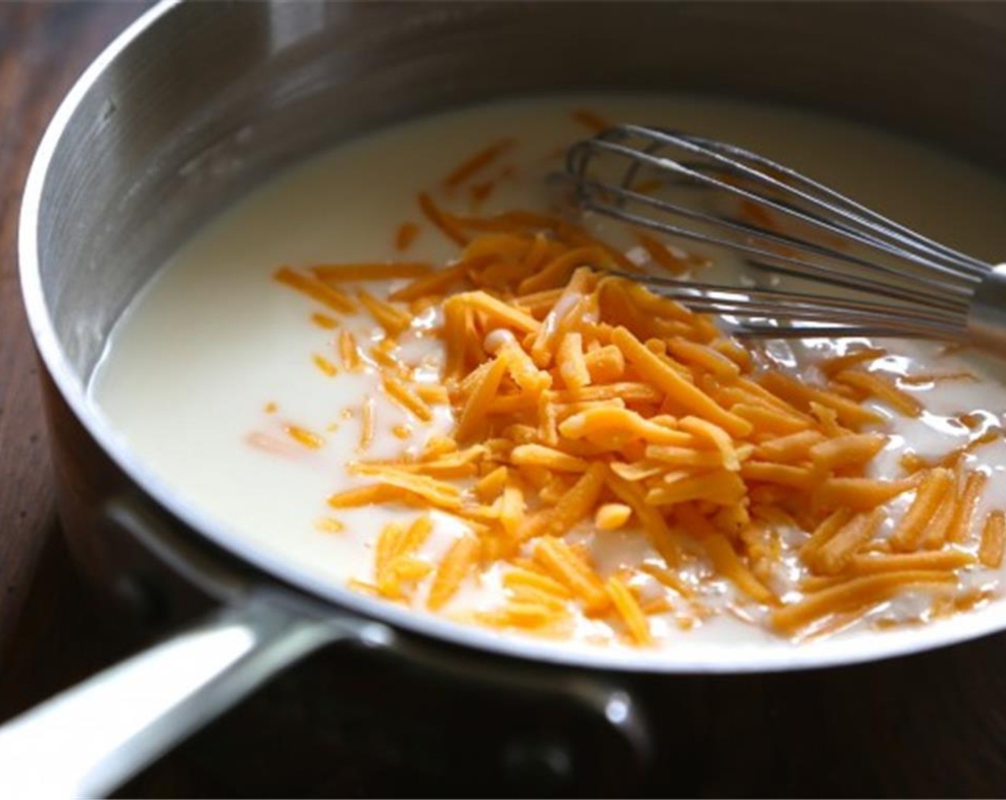 step 10 Remove from heat and stir in Pink Kosher Salt (to taste) and Shredded Cheddar Cheese (2 cups). Make sure everything is combined.