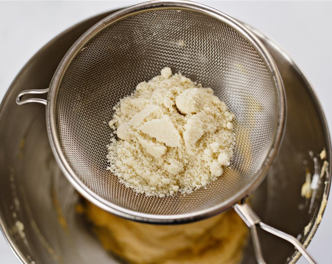 step 14 Remove bowl from stand mixer, and sift in Almond Meal (1/3 cup).