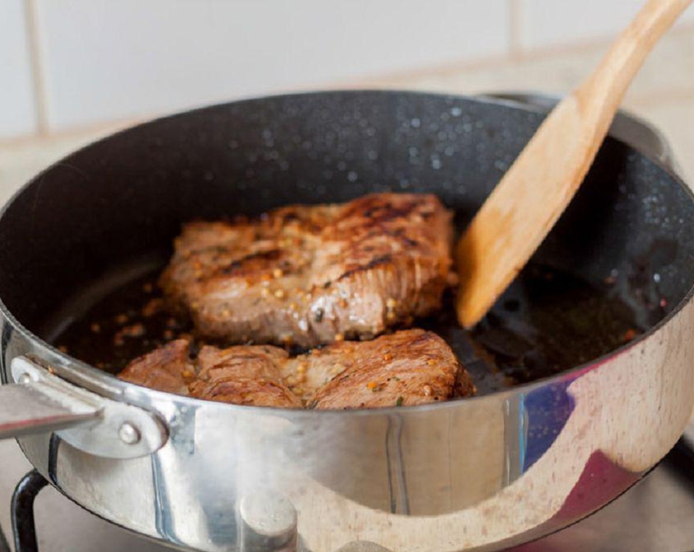 step 5 Place a large nonstick skillet over medium-high heat, then coat with cooking spray or oil. Cook the pork chops for about 3 minutes.