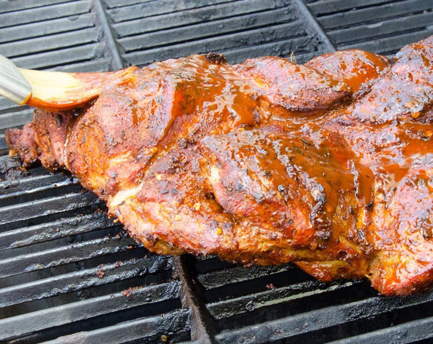 step 12 During the last 15 minutes of cooking, liberally brush the barbecue sauce over the meat. Cook for 5 or so minutes, then flip the meat and brush sauce on the other side. Cook for 5 minutes and flip again, so the sauce forms a nice crust.