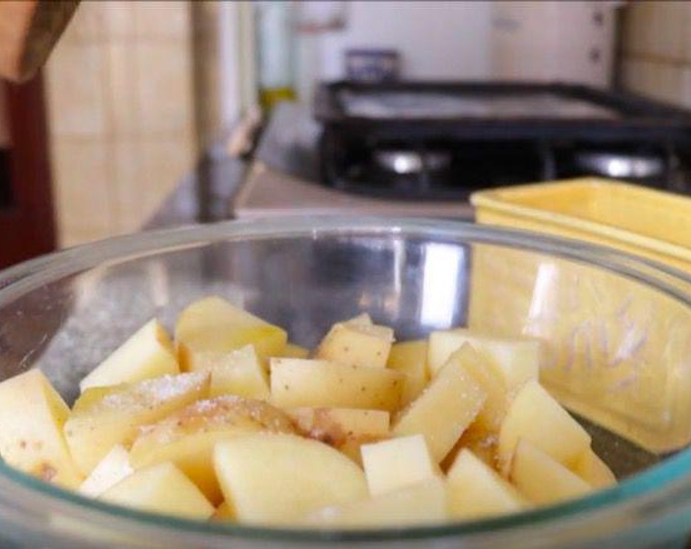 step 4 Place the potato pieces in a bowl, drizzle in Extra Virgin Spanish Olive Oil (1 Tbsp), then season with Sea Salt (to taste) and Ground Black Pepper (to taste) and toss together until well combined.