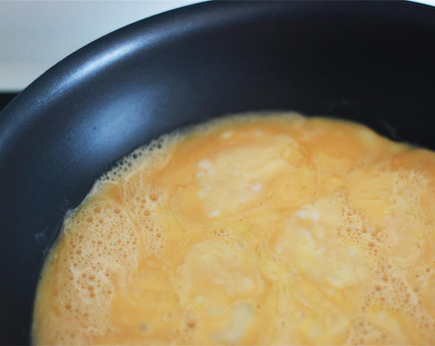 step 5 Beat the Eggland's Best Classic Eggs (3) well and add a Salt (1 pinch) and mix again. Low heat the pan, wait, and then drop Butter (1 Tbsp) and spread it on the pan. Wait until the butter becomes white-ish and bubbly. Add the eggs and wait. Slowly scrape the eggs to the center with a spatula.