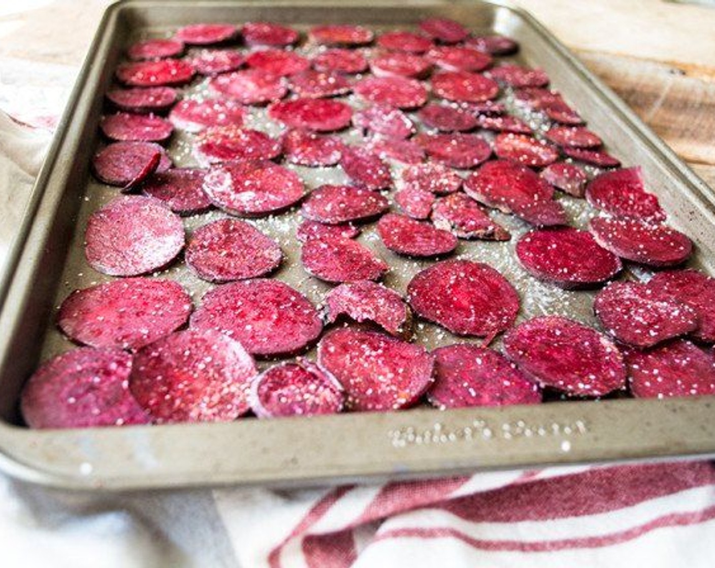 step 3 Add sliced beets to medium bowl, spray with Coconut Oil Cooking Spray (as needed), and toss to coat. Spray the baking sheet with another light layer of coconut oil cooking spray, then arrange in a single layer.