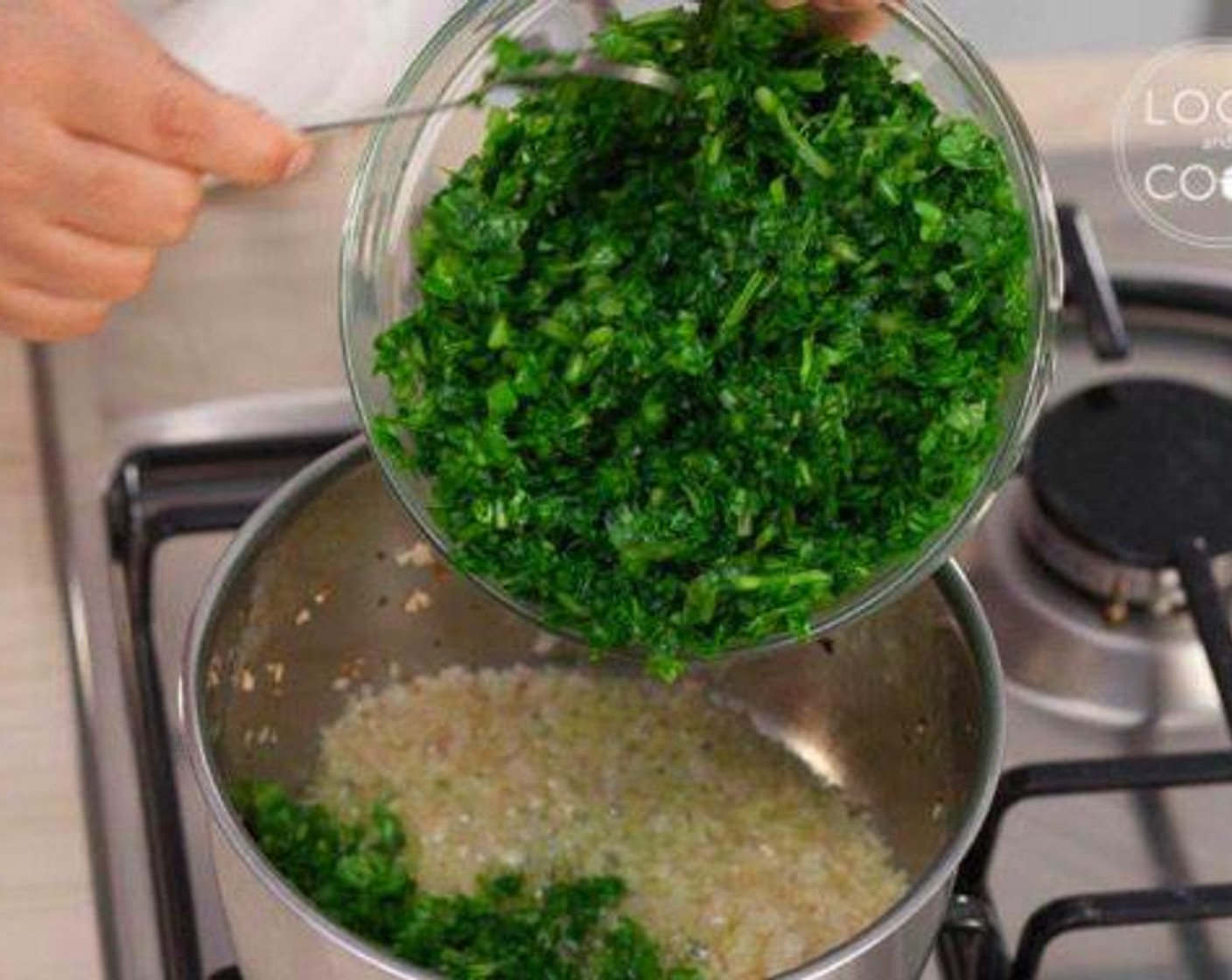 step 1 In a pan, cook Onion (1/3 cup) in Olive Oil (3 1/3 Tbsp) for about 2 minutes and add Fresh Spinach (10.5 oz).