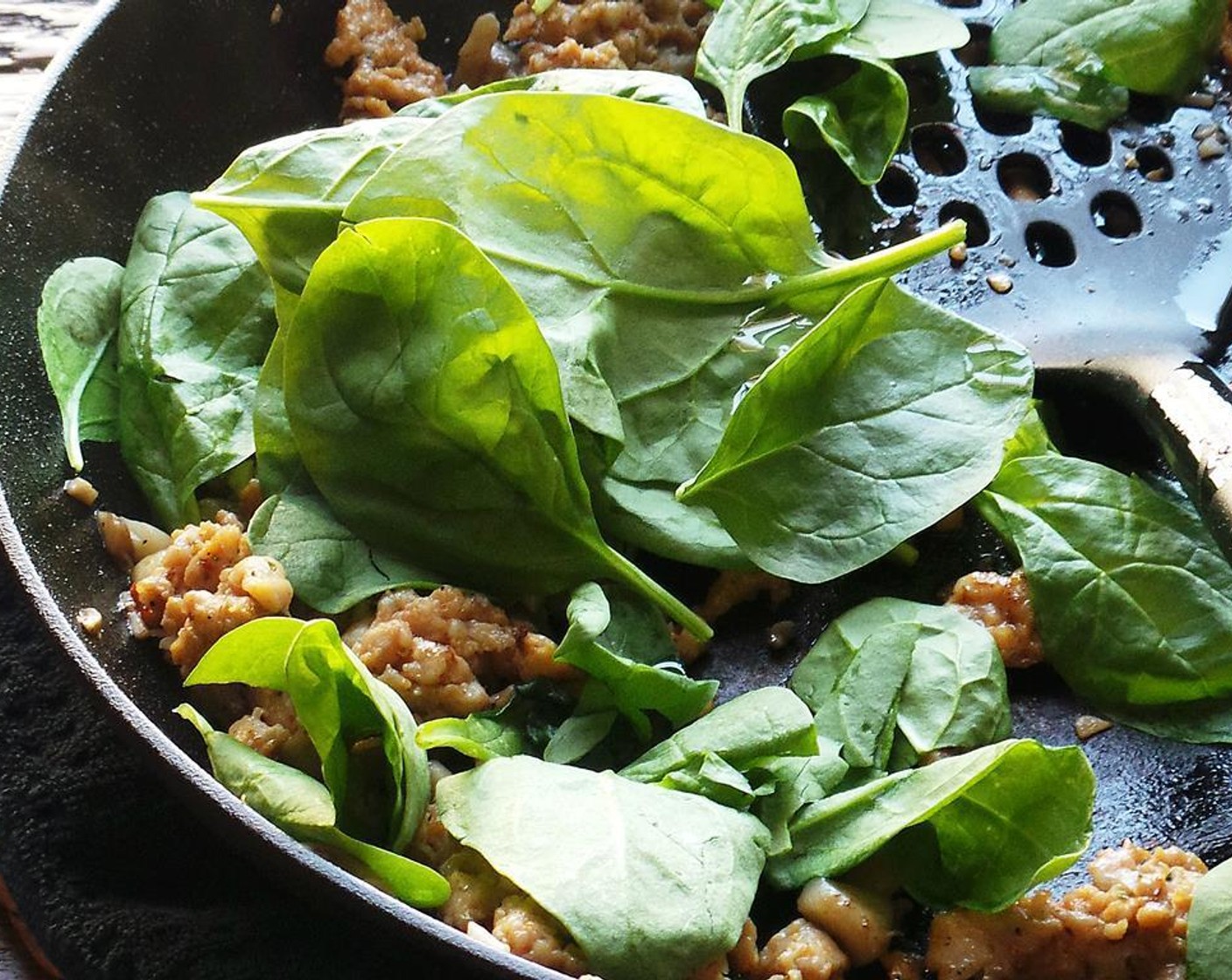 step 4 Add the Garlic (2 cloves) and Crushed Red Pepper Flakes (1 pinch) and cook until fragrant, about 30 seconds. Add the Spinach Leaves (2 cups) and cook until it's wilted.