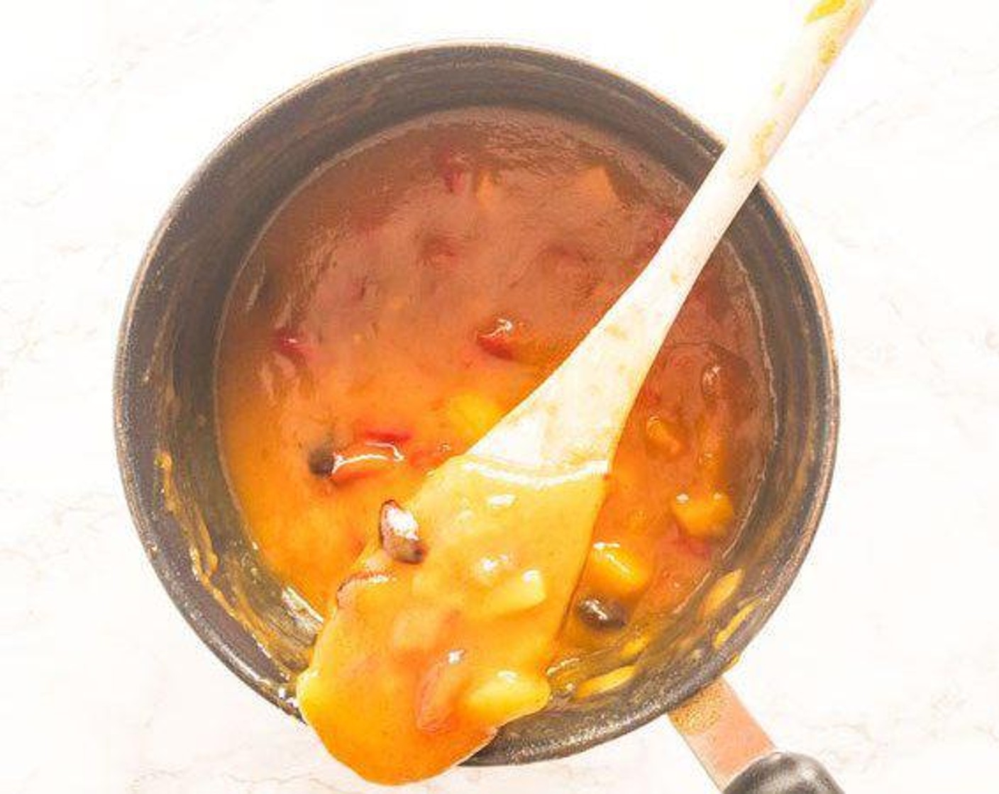 step 2 Add mangoes, Brown Sugar (1/3 cup), Red Chili Peppers (4 Tbsp), Apple Cider Vinegar (1 Tbsp), Sun-Maid Raisins (1 Tbsp), Ground Ginger (1 tsp), and Cayenne Pepper (1/4 tsp) to a pot and cook on stove top until bubbling, stirring continuously for about 2 minutes.