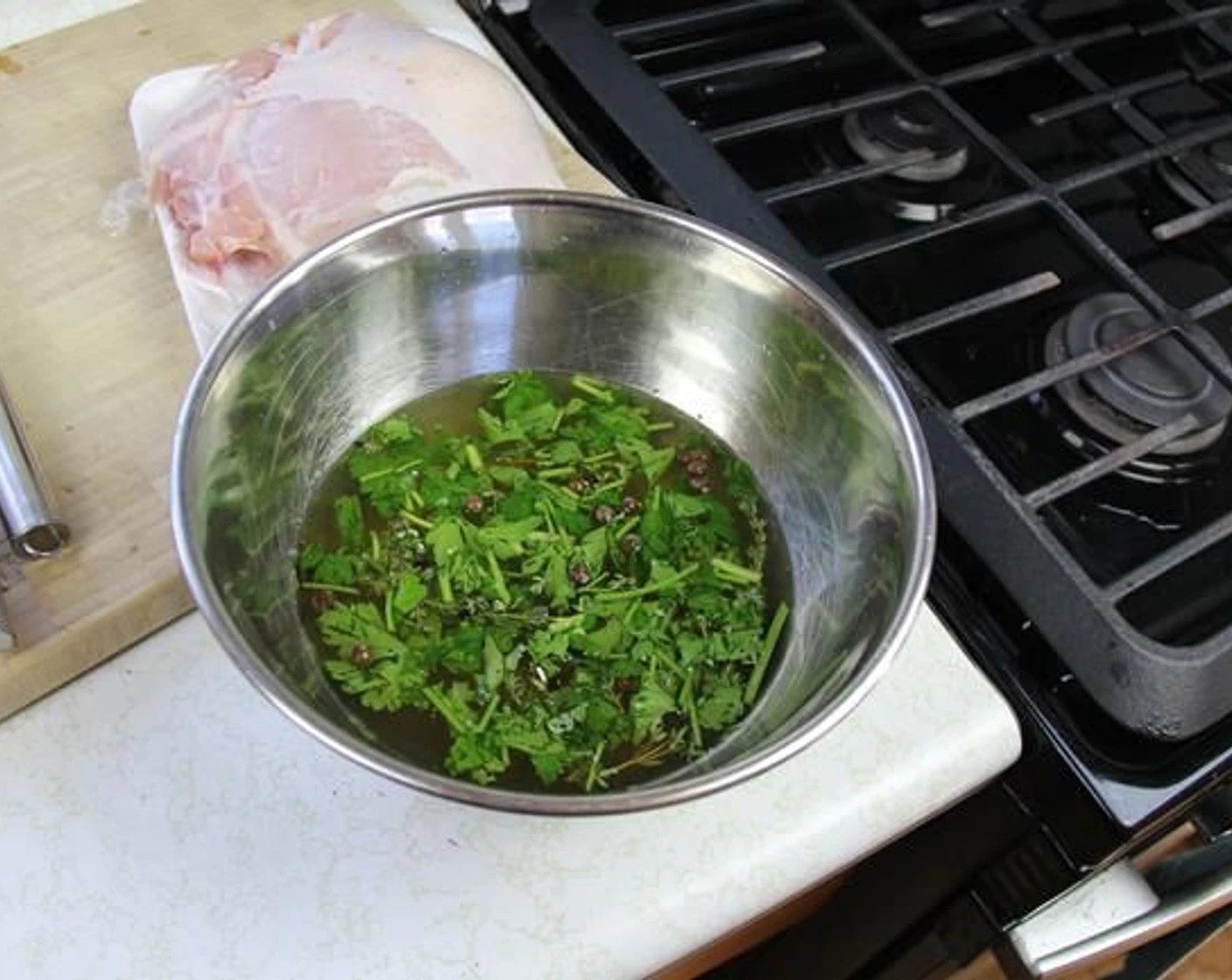 step 2 In a large bowl, place 1 cup of Water (1 cup), then add the Brown Sugar (1 Tbsp), Salt (1 Tbsp), Garlic (4 cloves), Black Peppercorns (7), Whole Allspice (5), Fresh Thyme (5 sprigs), and Fresh Parsley (2 Tbsp) and whisk. Try to be a bit rough to bruise the herbs so they release their flavors.