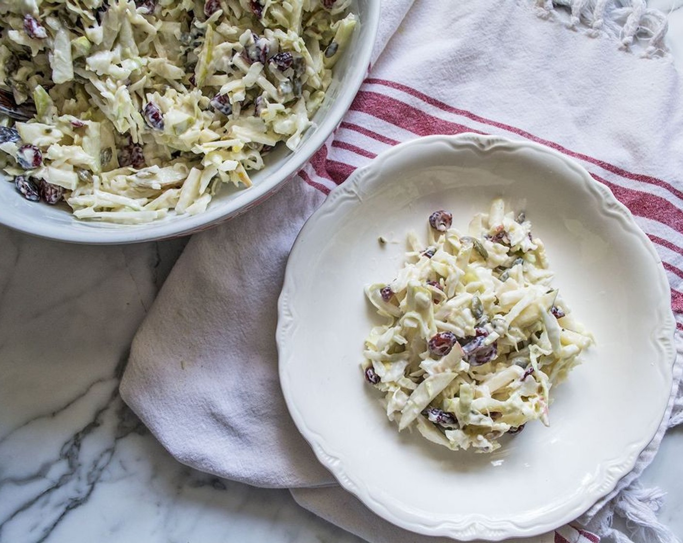 step 3 Pour yogurt dressing over cabbage and apples, toss to coat and serve.  You can store it in the refrigerator for up to 5 days.