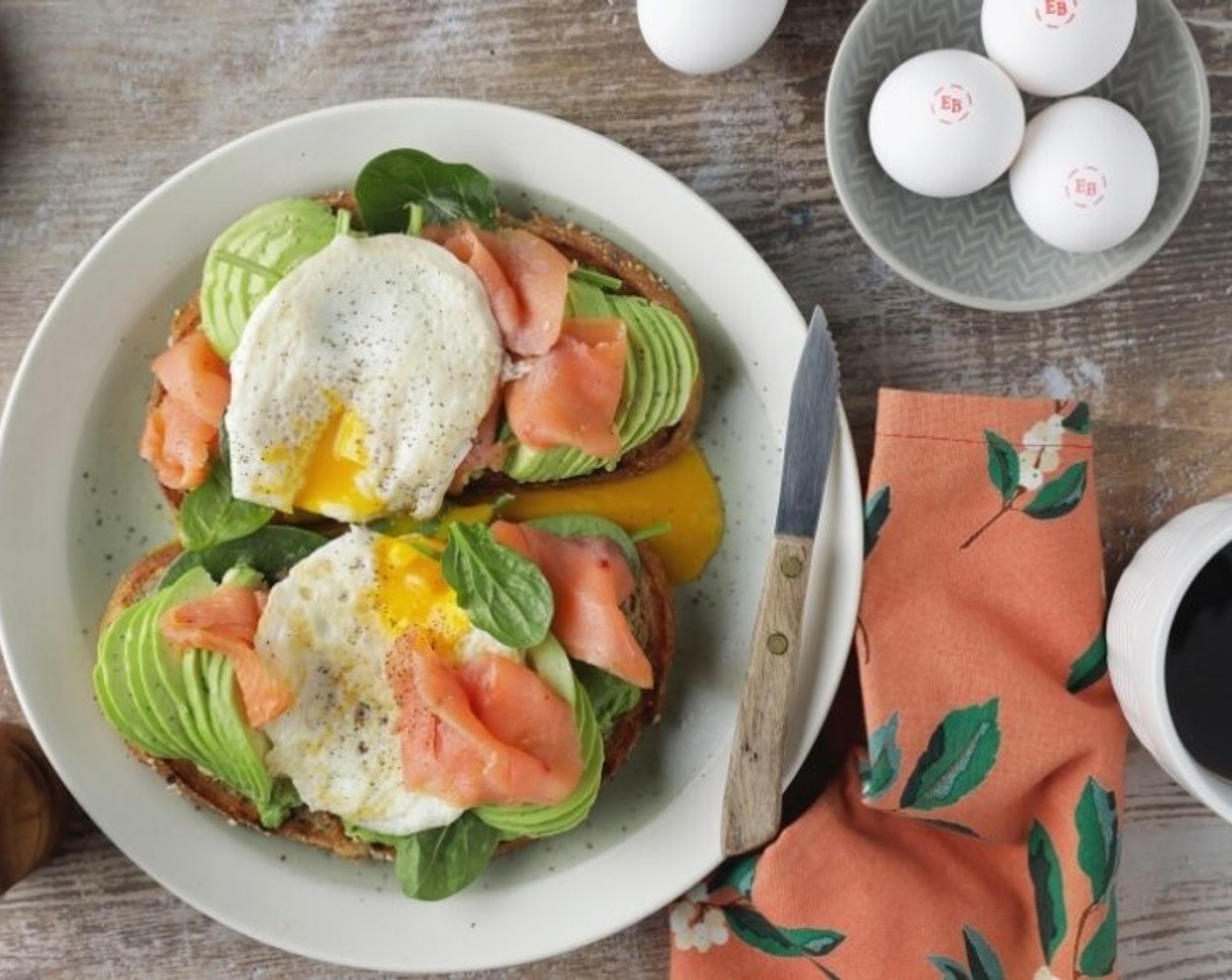 step 2 Top each piece of Whole Grain Bread (2 slices) with equal amounts of (in this order): mashed Avocado (1/2), Fresh Spinach (1 cup), Smoked Salmon (2 oz), and top with a cooked egg and sprinkle of Ground Black Pepper (to taste).