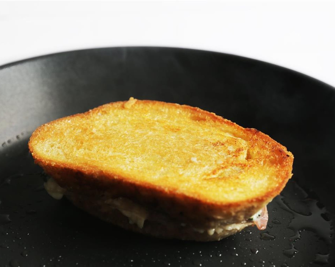 step 8 When underside is golden brown, about 4 minutes, turn sandwich and cook for another 4 minutes until both sides are golden brown.