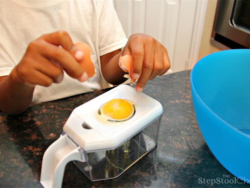 Step 9 of Simple Vanilla Soufflé Recipe: First, separate your Large Egg (4). This can be tricky for little chefs which is why we used this Norpro Multi Grater with Juicer which is a multi-purpose tool that has an egg separator.