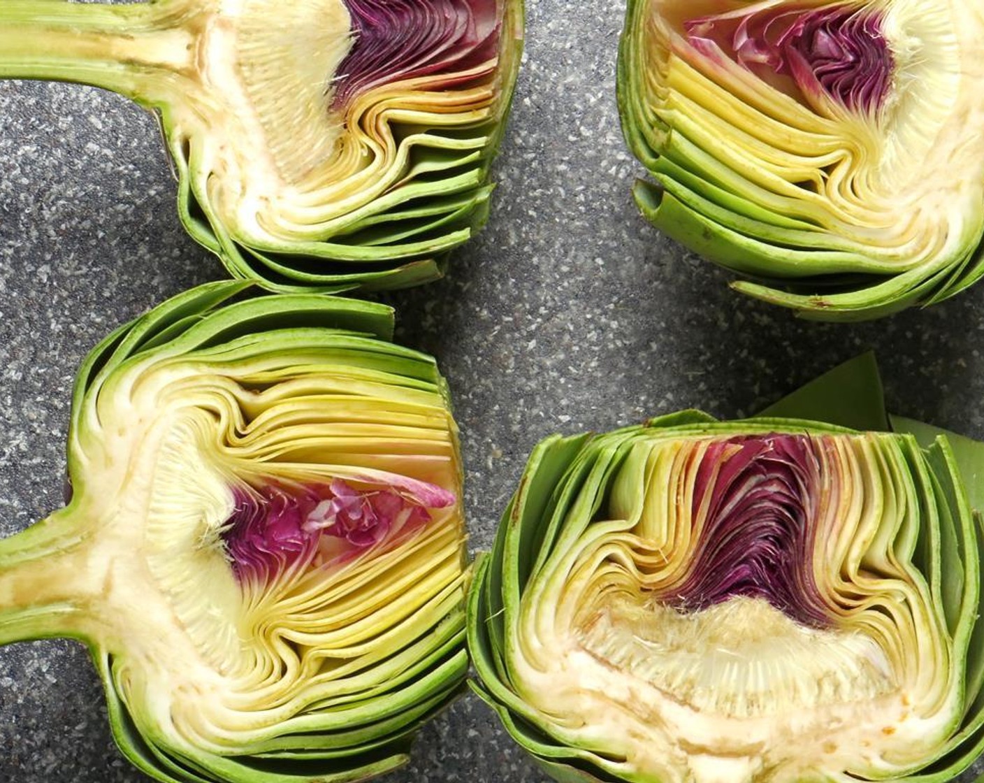 step 4 Slice the artichoke in half lengthwise.