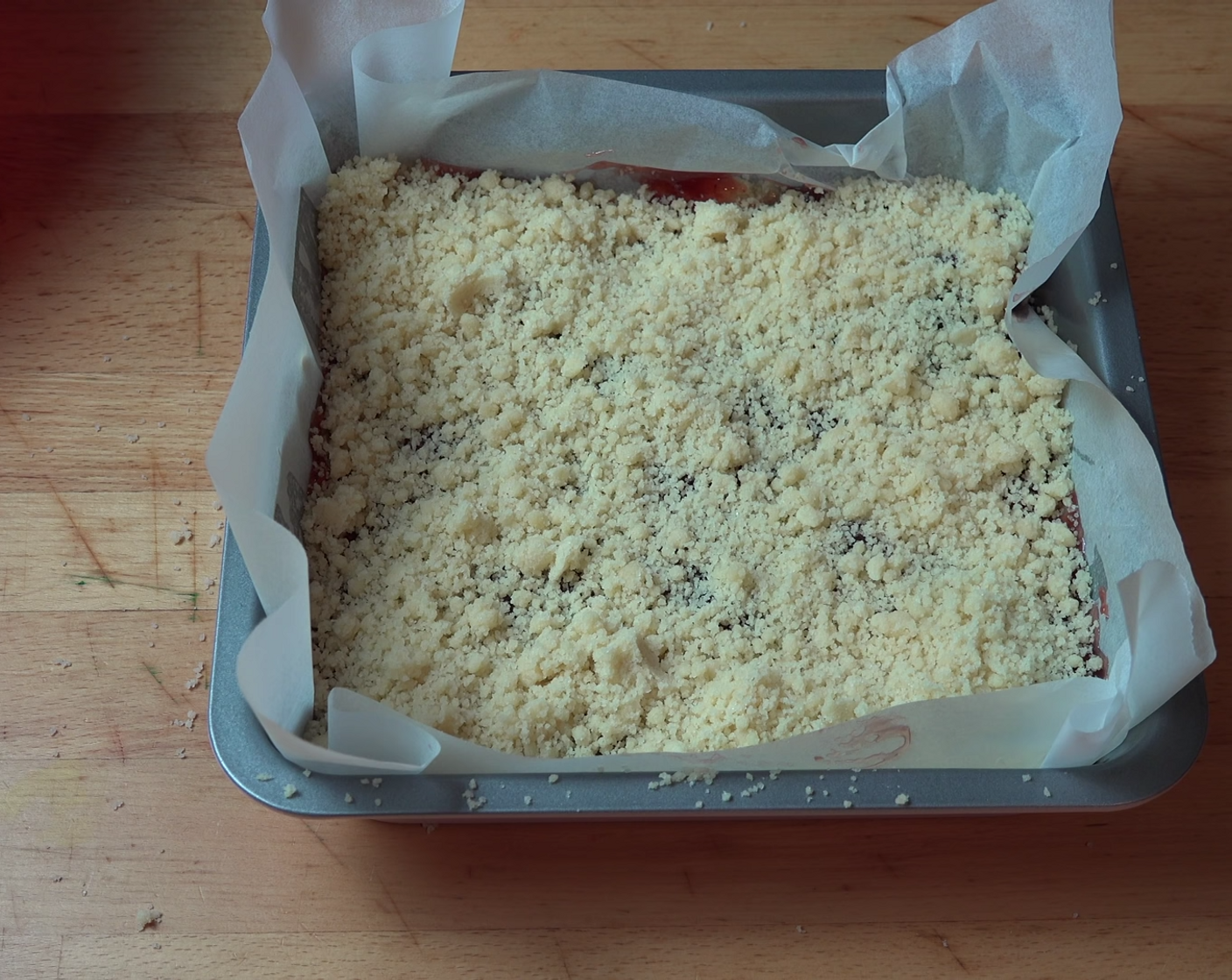step 10 Scatter the crumble mixture over the top of the shortbread slice.