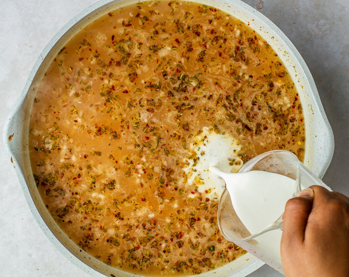 step 6 Reduce the heat to low and stir in the Heavy Cream (1/2 cup), then cover the skillet. Let the orzo simmer for 3 minutes.