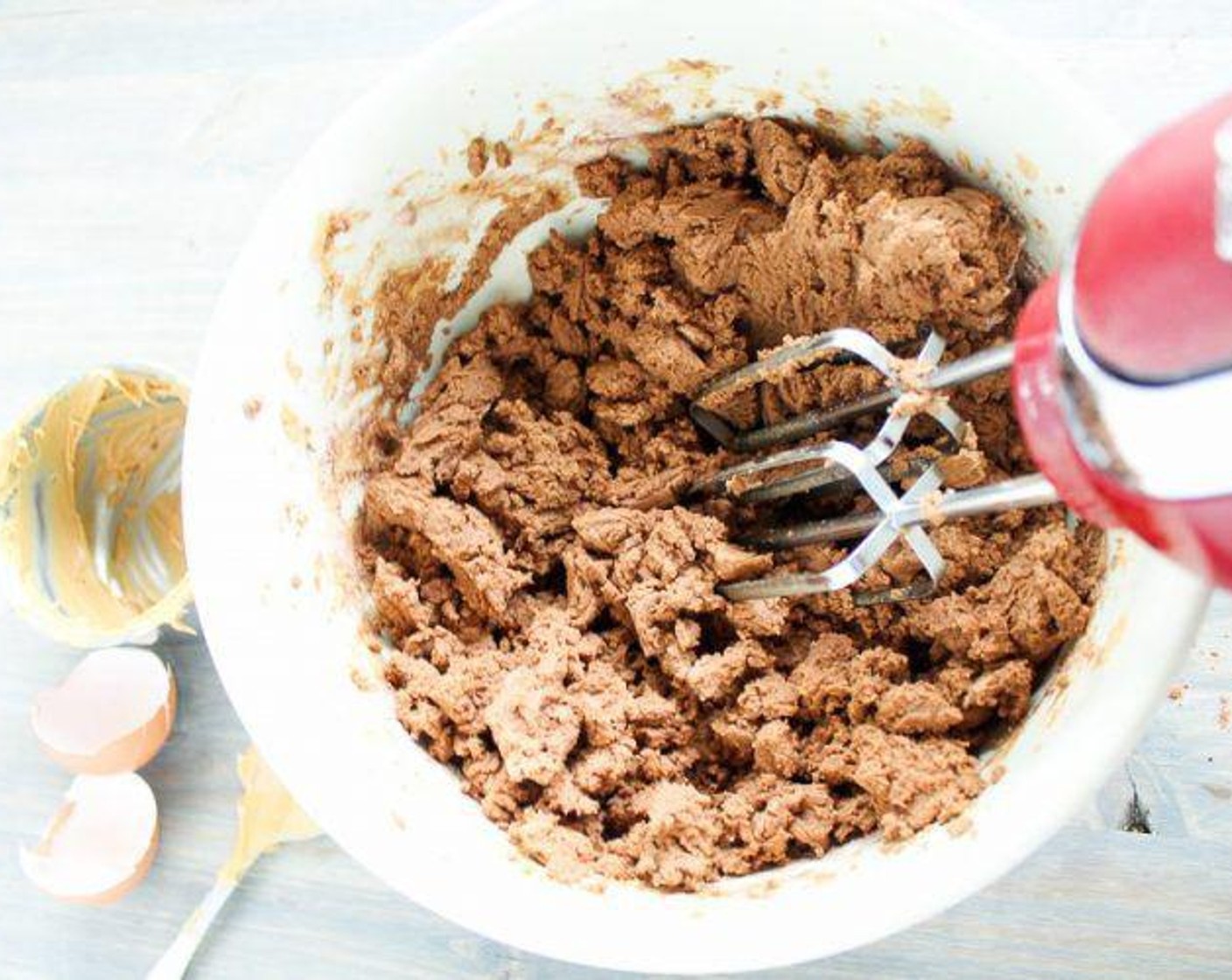 step 4 Gradually mix in the flour and cocoa mixture. Beat until the cookie dough is moist and comes together.