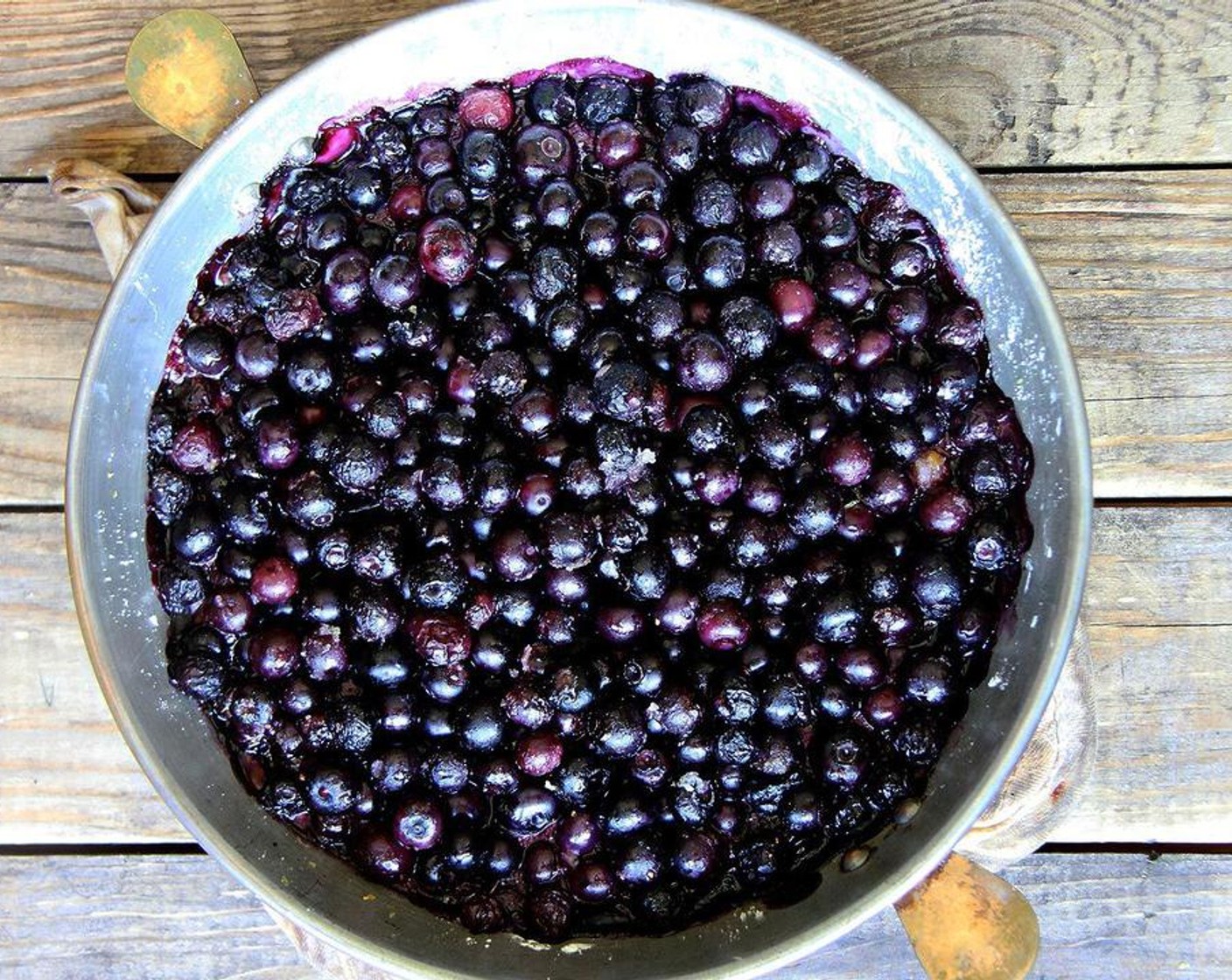 step 3 Transfer the berry mixture to a deep 9-inch pie plate or 9x13-inch vessel. Place pan on a rimmed baking sheet, and bake until the filling is hot and bubbling around the edges, about 25 minutes.