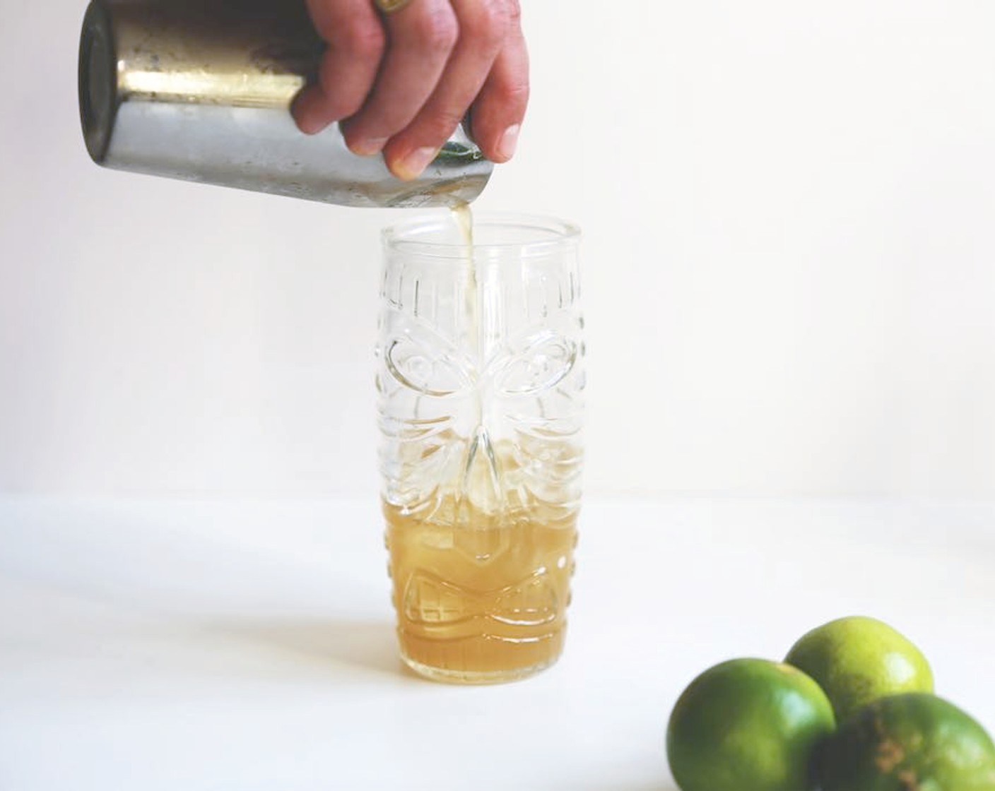 step 7 Add ice to a tall glass and pour out the inside mix using the strainer.