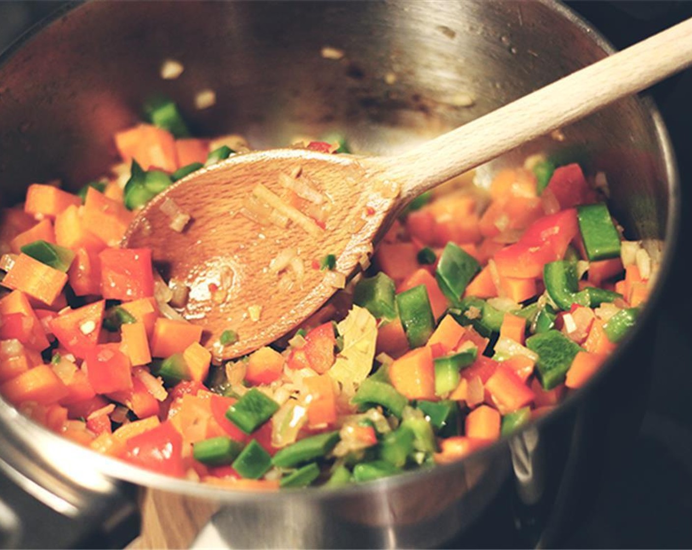 step 3 Add the Onions (3), carrots, pepper, and Bay Leaves (3) and cook for around 8-10 minutes.