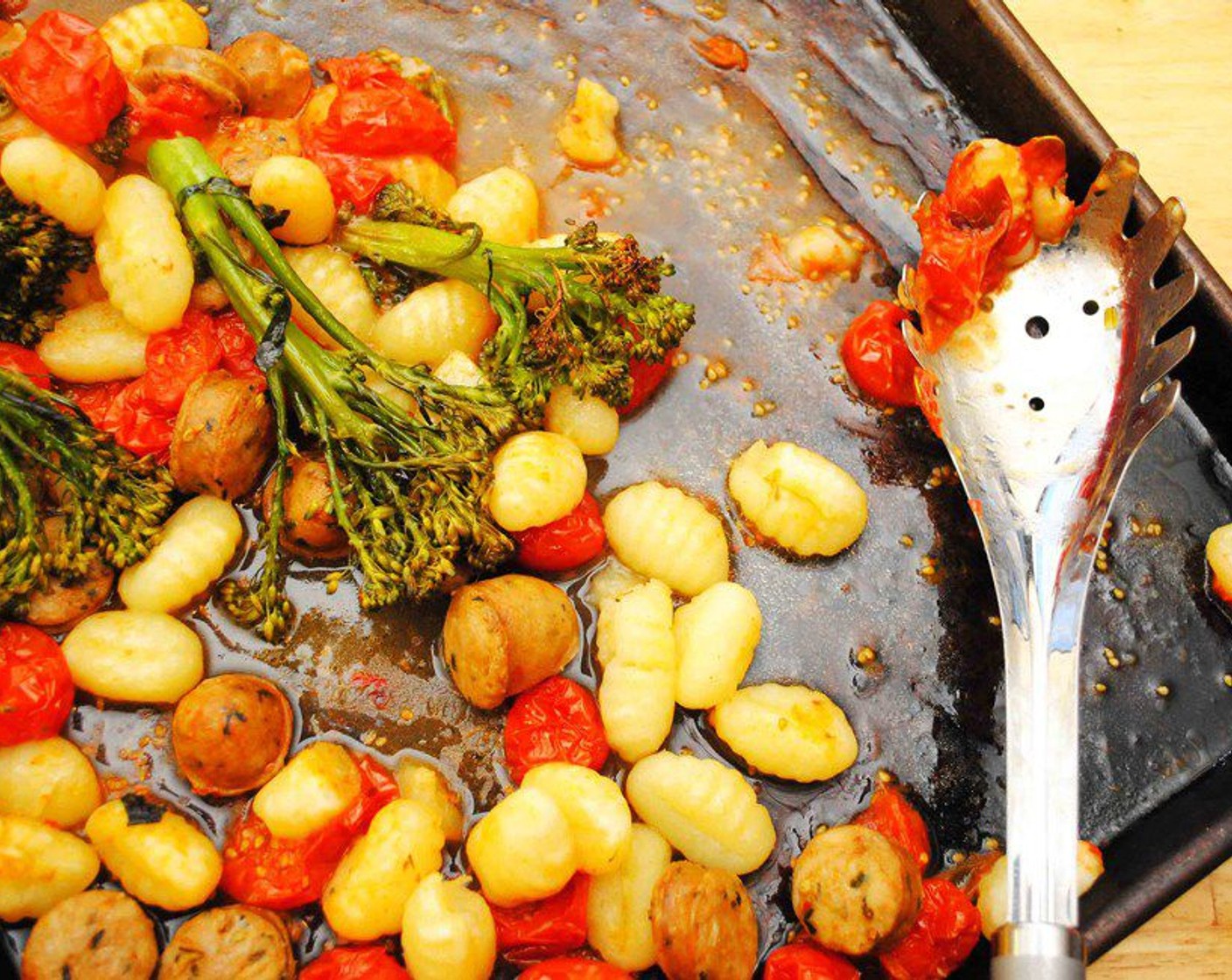 step 5 Put the broiler on and move the pan closer to the top of the oven. Cook for 4 minutes more to brown the tomatoes. Pull out of the oven and serve warm.