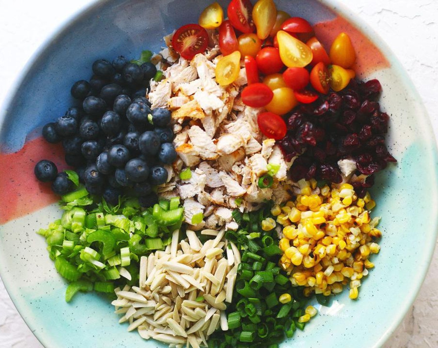 step 1 In a large bowl, place Fresh Blueberry (1 cup), Celery (1 cup), Grape Tomatoes (1 cup), Corn Kernels (1/2 cup), Slivered Almonds (1/2 cup), Scallion (1/2 cup), Dried Cranberries (1/2 cup), and Chicken (4 cups).