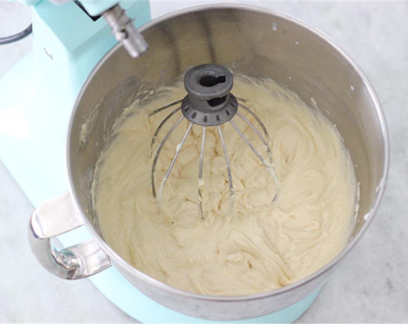 step 3 Turn the mixer on low speed and add the Butter (3/4 cup) one piece at a time, until the mixture looks like wet sand. Also add Eggland's Best Classic Eggs (3) one at a time, mixing until the mixture comes together.