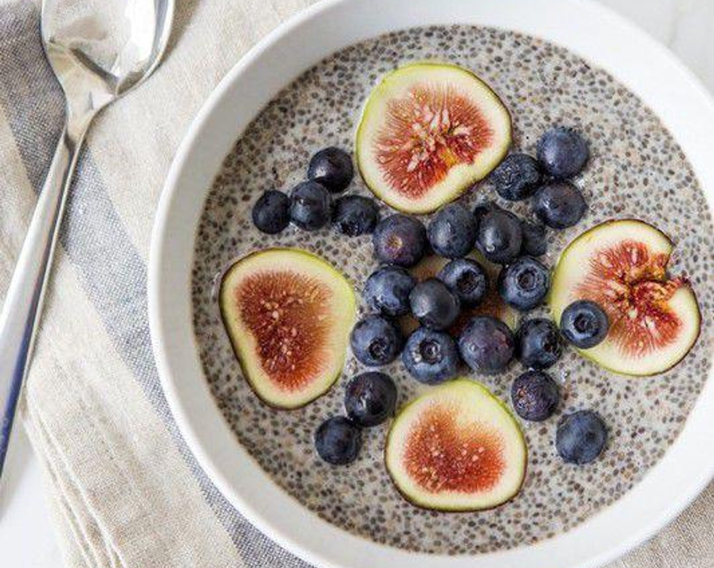 step 1 Mix together Cashew Milk (2 cups), Chia Seeds (1/2 cup), Vanilla Extract (1/2 tsp), Honey (2 Tbsp) in a bowl. Cover and refrigerate overnight. Top with Fresh Blueberry (1/2 cup) and Figs (4) in the morning. Serve and enjoy!