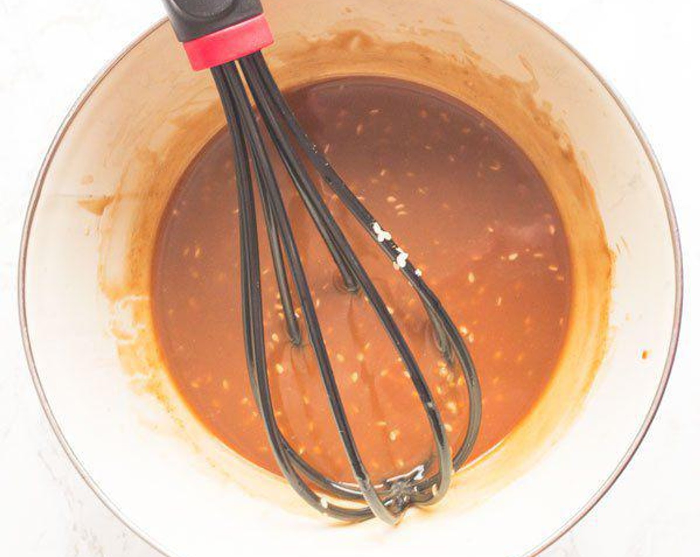 step 3 In a separate bowl, whisk Canola Oil (1/2 cup), Low-Sodium Soy Sauce (4 Tbsp), Creamy Natural Peanut Butter (4 Tbsp), Maple Syrup (4 Tbsp), Toasted Sesame Oil (1 Tbsp), and Sesame Seeds (1 Tbsp).