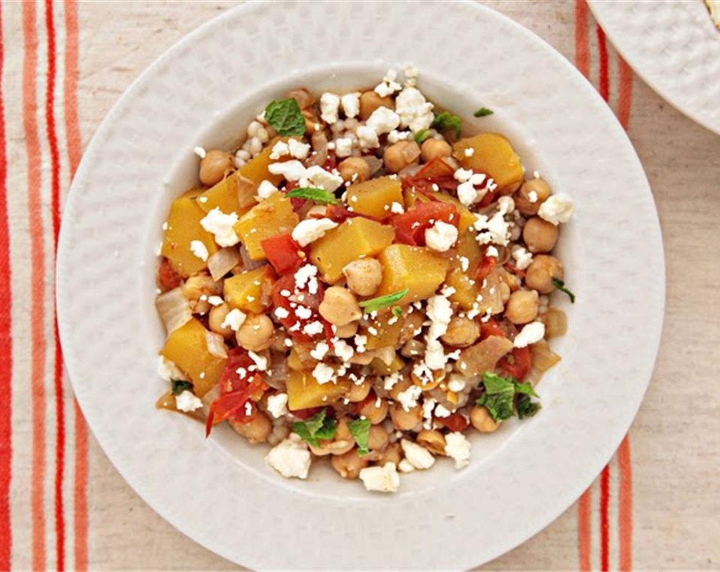 step 10 Season the stew with Kosher Salt (to taste) and Ground Black Pepper (to taste). Divide the israeli couscous between the bowls, ladle the stew on top, then finish with fresh mint leaves, Olive Oil (1 Tbsp) and feta cheese. Enjoy!