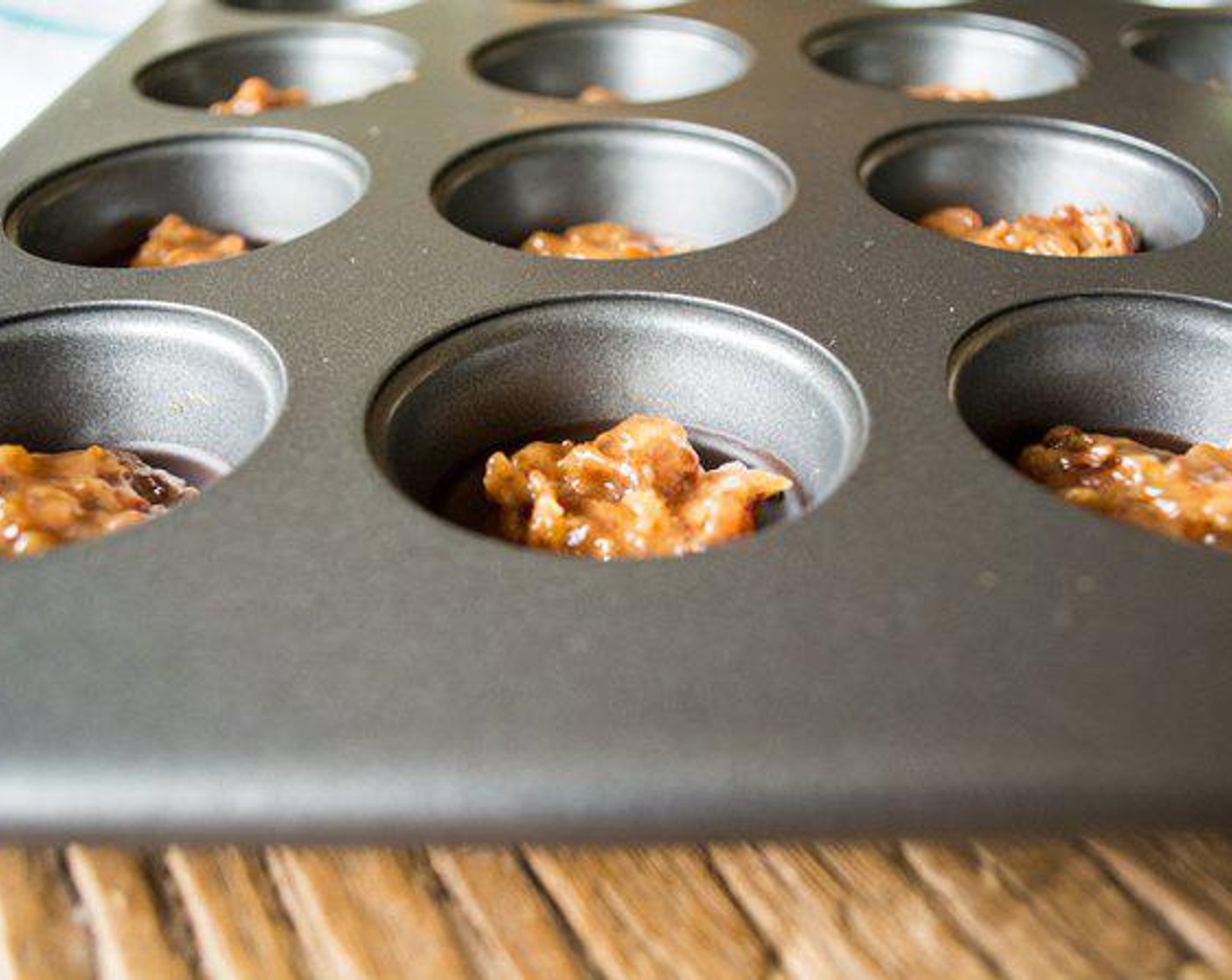 step 5 Remove the chocolates from the freezer. Spoon a little of the caramel into each mold on top of the set chocolate, spread caramel flat. Spoon remaining melted chocolate over top, covering the caramel completely. Place pan back in the freezer to set.