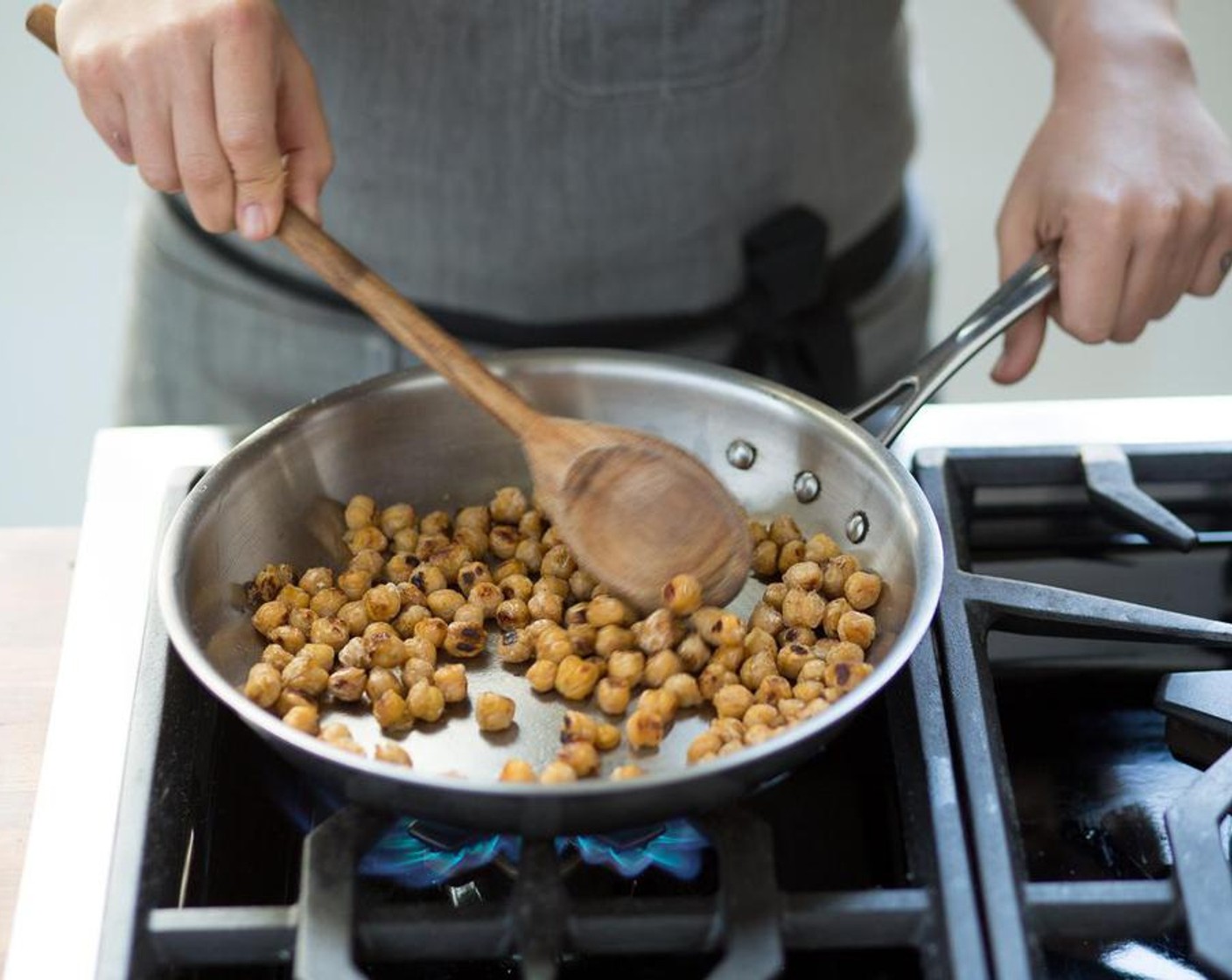 step 4 In a medium sauté pan over high heat, add Olive Oil (1 Tbsp). When the oil is hot, add the Chickpeas (1 can) and sauté for 4 minutes until golden brown. Remove from heat and set aside.