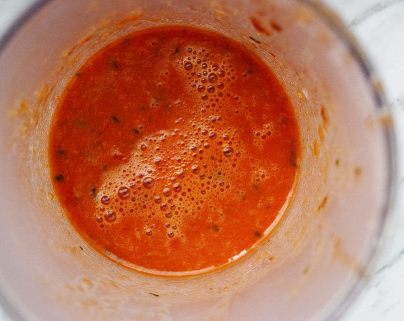 step 4 Puree the tomatoes, garlic and Vegetable Broth (1/4 cup) with an immersion blender. Set aside.