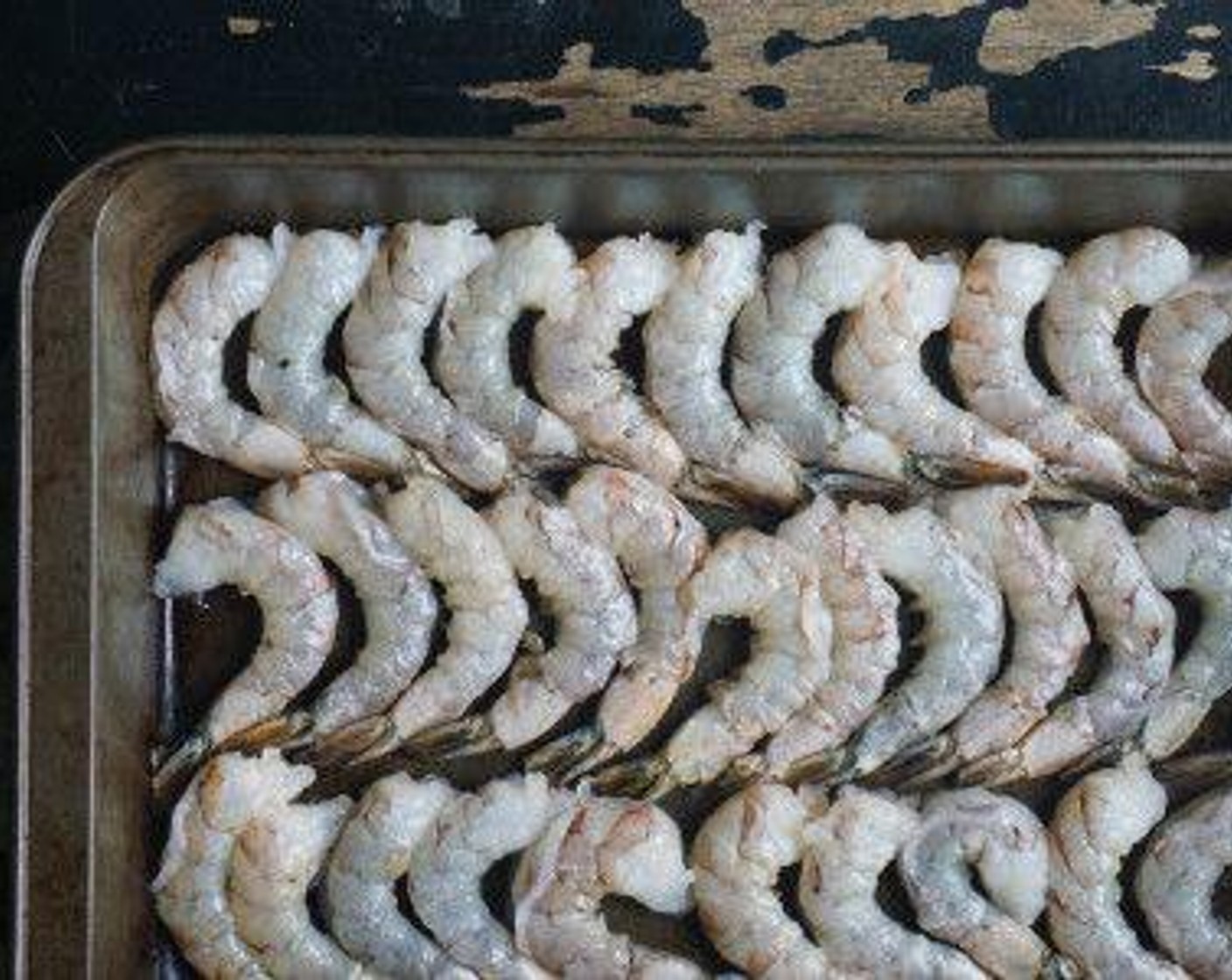 step 2 Lay the Medium Shrimp (2 lb) snug in a baking dish in one layer, only allowing the tails to overlap.