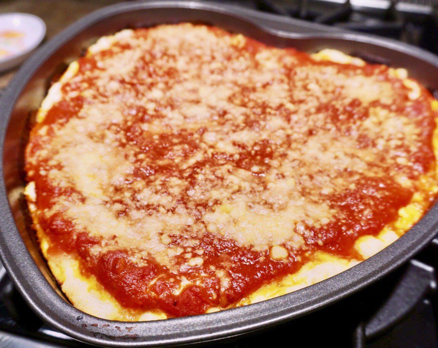 step 13 Allow the pizza to cool slightly, then use two long spatulas to remove the pie from the pan and place on a cutting board. Slice, serve and enjoy!